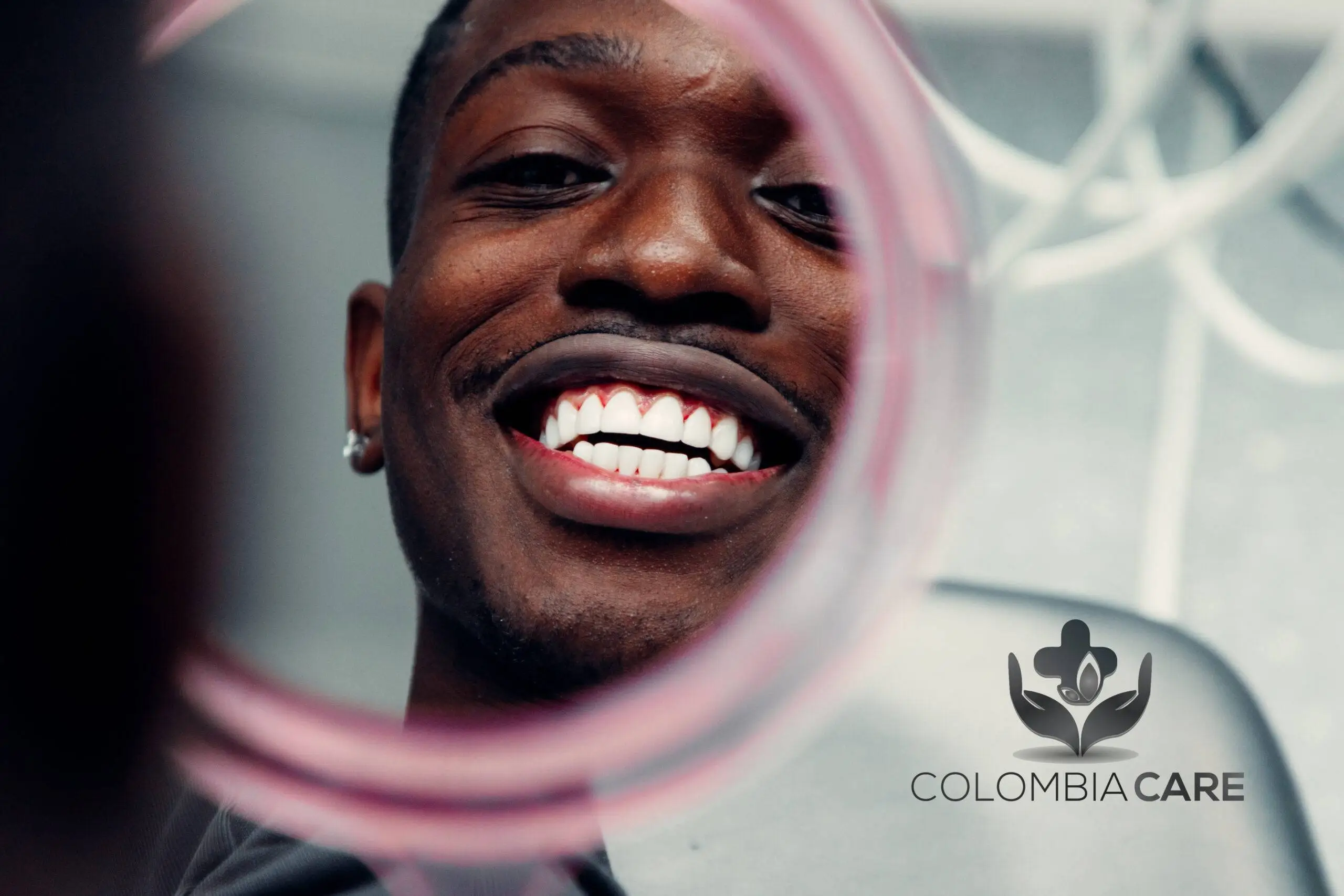 Patient checking smile in mirror after composite veneers